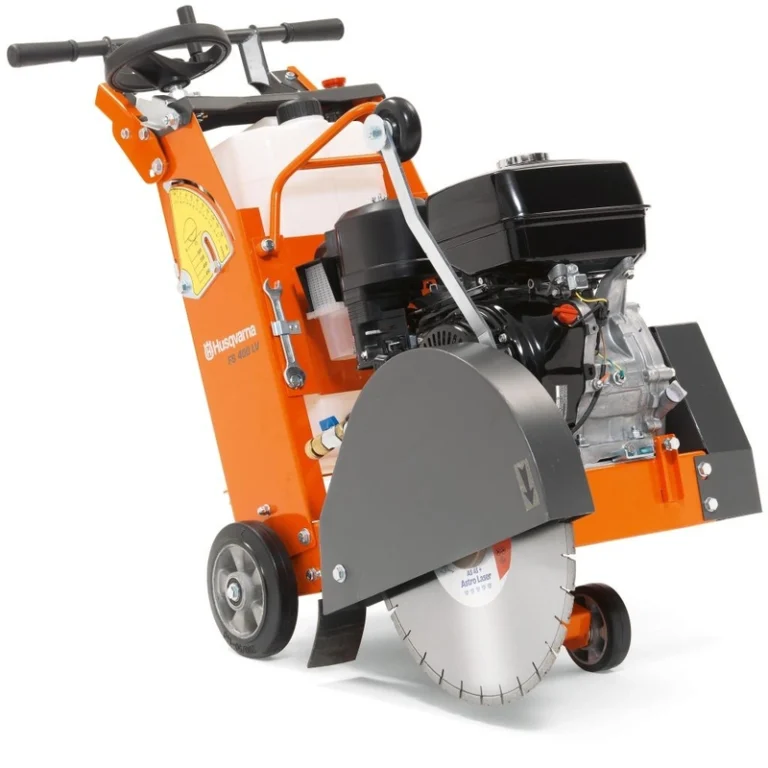 An orange floor saw with black protection covers and black handles to operate